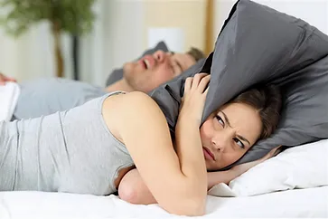 women can't sleep , man snoring in the back